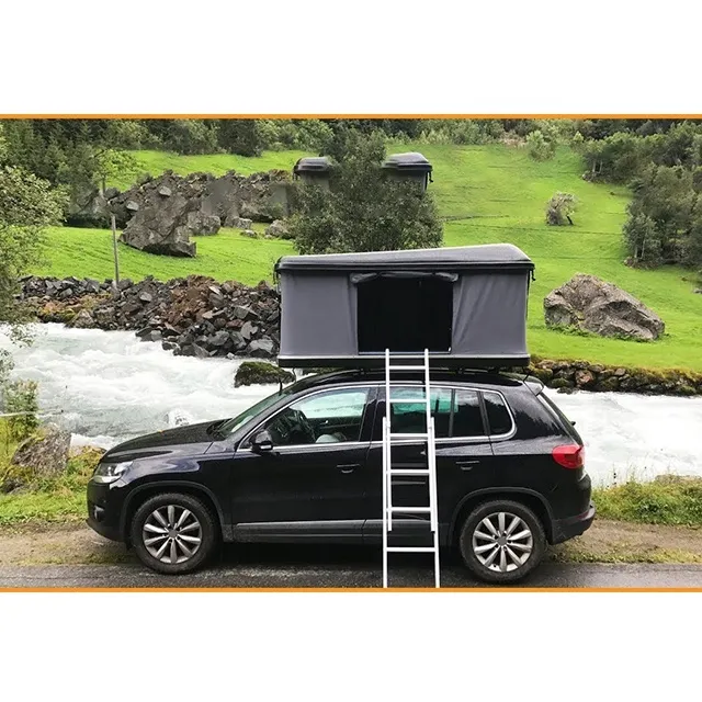 Rooftop tent beside a river